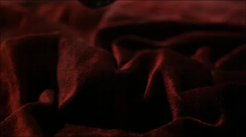 Super slow motion shot of sword falling onto velvet surface Video stock 64655687