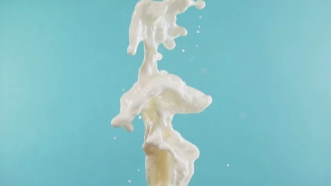Super Slow Motion Shot of Vertical Splashing Fresh Milk at 1000 fps. Stock Footage 276082658