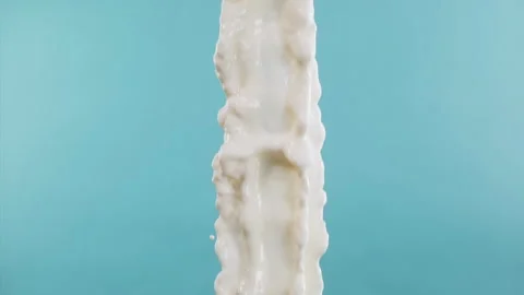 Super Slow Motion Shot of Vertical Splashing Fresh Milk at 1000 fps. Stock Footage 276082792