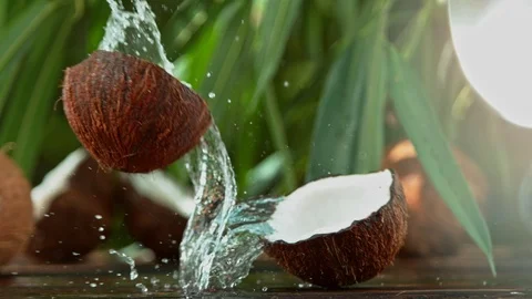 Super Slow Motion Shot of Water Splashing from Coconut at 4K. Stock Footage