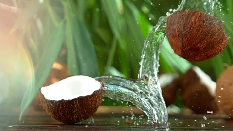 Super Slow Motion Shot of Water Splashing from Coconut at 4K. Stock Footage