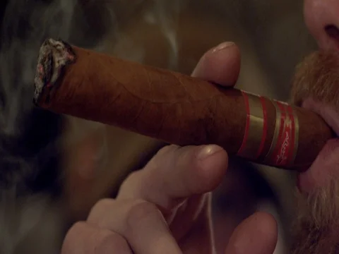 Super Slow Motion Smoking a Cigar and Blowing Smoke Stock Footage 71507947