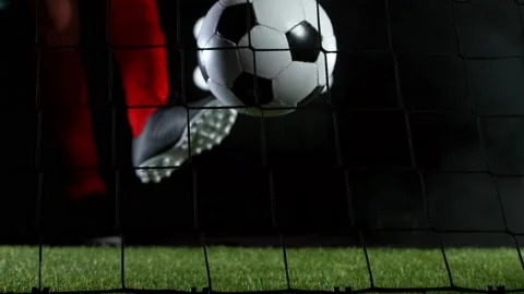 Super slow motion of soccer player kicking the ball into goal. Stock Footage 145087445