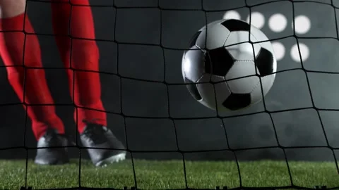 Super slow motion of soccer player kicking the ball into goal. Stock Footage 145090811