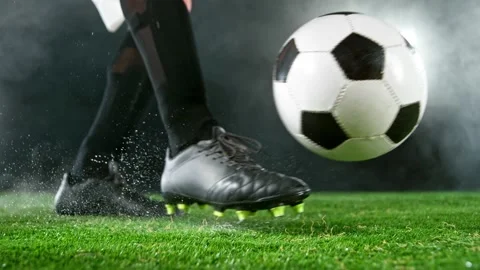 Super slow motion of soccer player kicking the ball Stock Footage 175296549