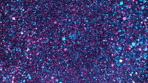 Super slow motion of sparkling abstract glittering background in neon colors Video stock 122179898