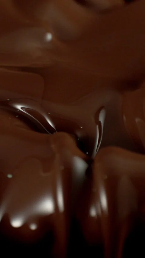 Super Slow Motion of Splashing and Mixing Hot Melted Chocolate. Stock Footage 297449516