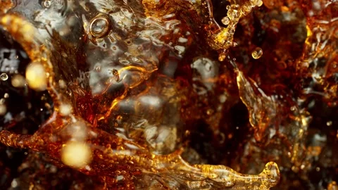Super slow motion of splashing cola drink or ice tea. Stock Footage 141771522