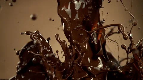 Super slow motion of splashing dark hot chocolate splashes Stock Footage 216864645