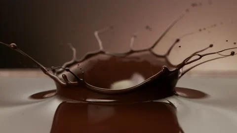 Super slow motion of splashing hot chocolate with crown shape. Stock Footage 150624852