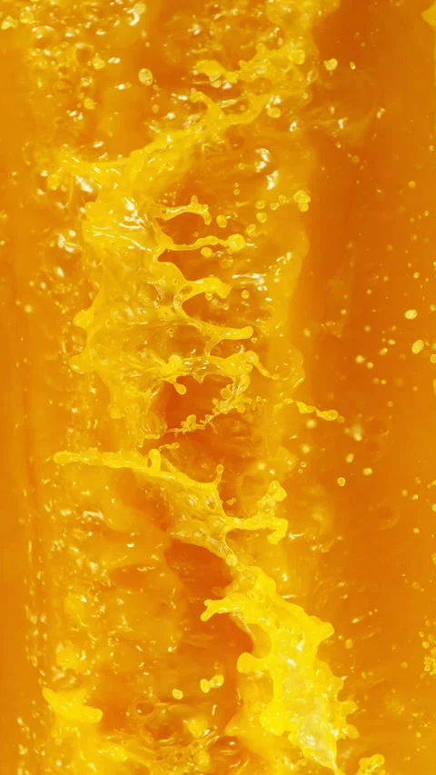 Super Slow Motion of Splashing Orange Juice. Stock Footage 309096517