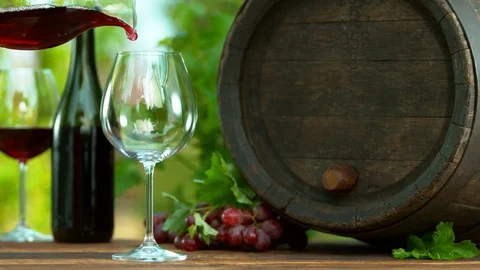 Super slow motion of splashing red wine into glass, still life composition Stock Footage 107057389