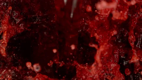 Super slow motion of splashing red wine in macro shot. Stock Footage 165298013