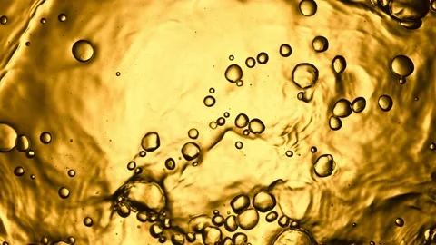 Super slow motion of splashing whiskey, cognac or oil surface. Stock Footage 168248848