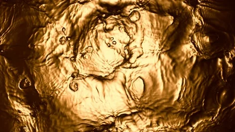 Super slow motion of splashing whiskey, cognac or oil surface. Stock Footage 168252153