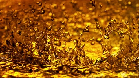 Super slow motion of splashing whiskey, cognac or oil. Stock Footage 168467853