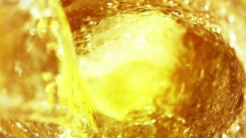 Super slow motion of splashing whiskey in twister shape, close-up. Stock Footage 211710036