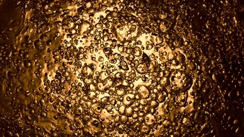 Super slow motion of splashing whisky, rum or oil. Stock Footage 168433845