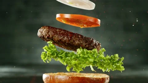 Super slow motion of stacking hamburger pieces Stock Footage 235904194
