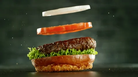 Super slow motion of stacking hamburger pieces Stock-Footage 235904791