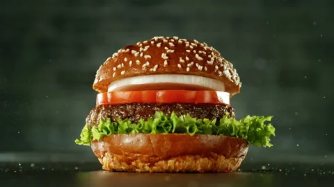 Super slow motion of stacking hamburger pieces Stock Footage 235905953