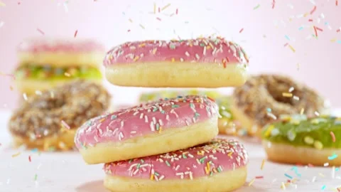 Super slow motion of stacking sweet donuts pieces Stock Footage 238441044