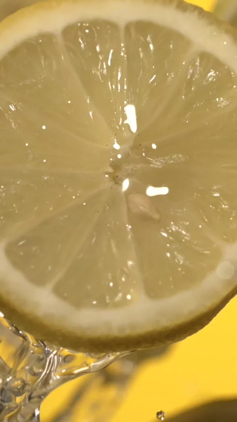 Super slow motion Studio image capturing sparkle and texture of lemon slices Stock Footage 326276038