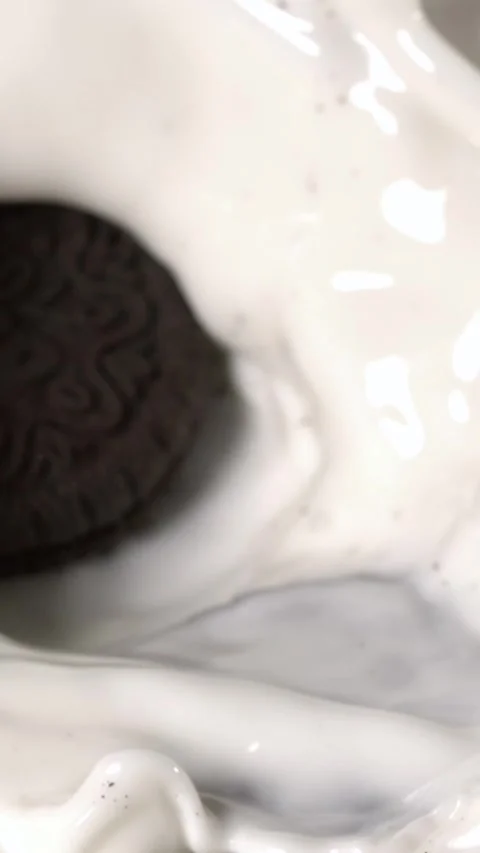 Super slow motion Studio image capturing cookies collapsing into splash of milk Stock Footage 326276190