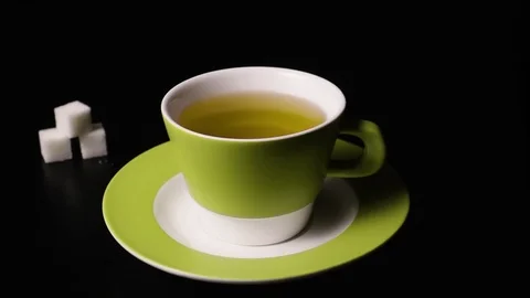 Super slow motion sugar cubes falling into tea Stock Footage 72863129