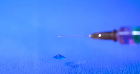 Super Slow Motion Syringe Needle Droplet Closeup  Stock Footage 333485232