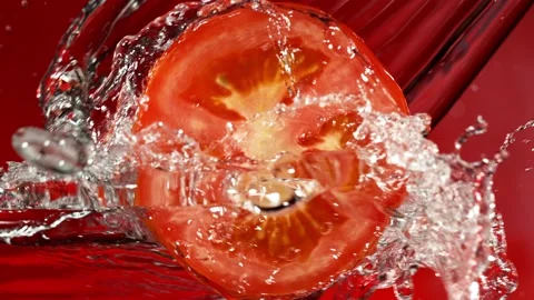 Super Slow Motion of Tomato Slice With Water Splashes. Stock Footage 201188719
