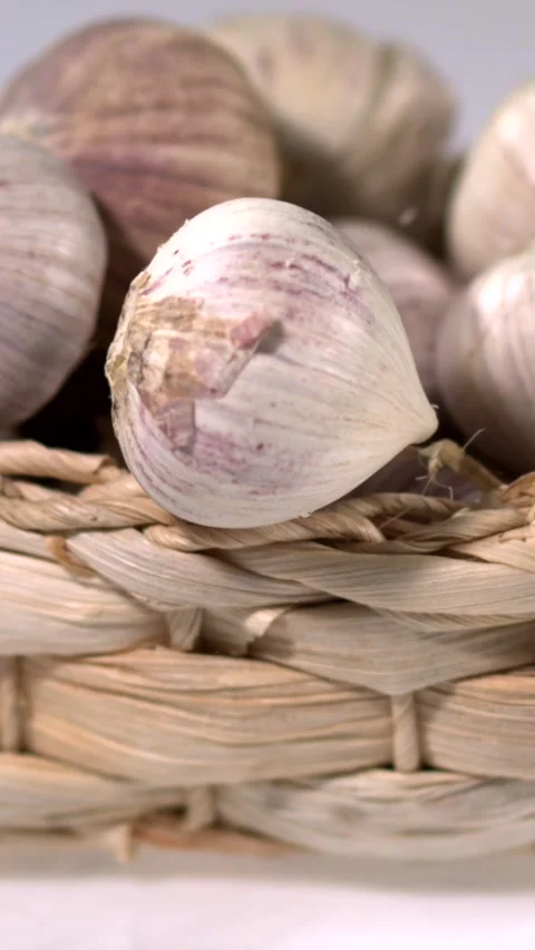 Super slow motion, Ultrafine Slow Motion Capture Of Garlic Cloves Falling Into W Stock Footage 331720857