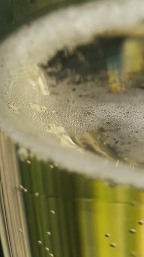 Super Slow-Motion Vertical Detail of Champagne Foam and Bubbles Stock Footage 341036358