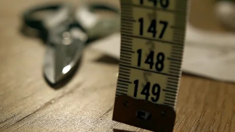 Super slow motion video of falling tailor measure tape. Handmade, tailoring Stock Footage 70583233