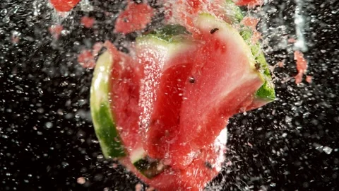 Super slow motion of water melon slices collision with water splashes Stock Footage 136781306