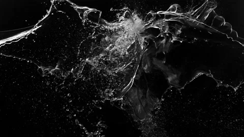 Super slow motion of water splashes in collision, isolated on black background. Stock Footage 154471981