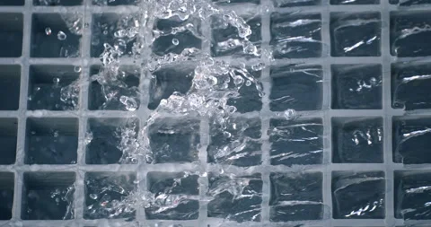 Super slow motion of water surface on light blue background. Video stock 269406435