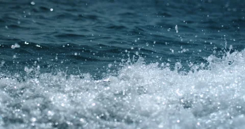 Super slow motion of water surface on light blue background. Video stock 269412290