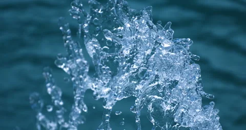 Super slow motion of water surface on light blue background. Stock Footage 269906890