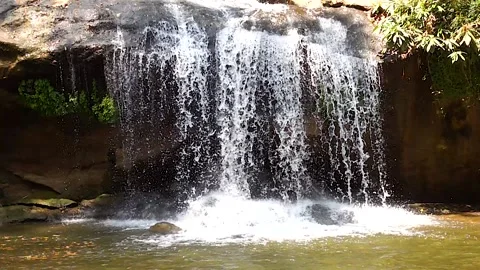 Super slow motion waterfall front of cave Stock-Footage 138752293