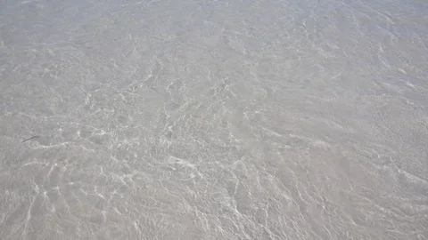Super slow motion of wave crushing and retreating on white sand beach Stock Footage 88647275