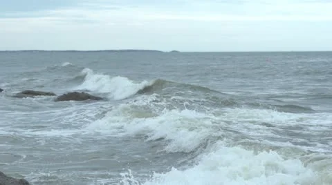 Super Slow Motion waves running up to beach and rocks. Stock Footage 11407865