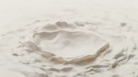 Super slow motion of waving milk liquid in macro shot. Stock Footage 150737157