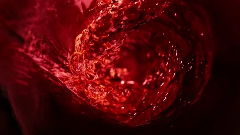 Super slow motion of waving red wine in macro shot. Stock Footage 165296509