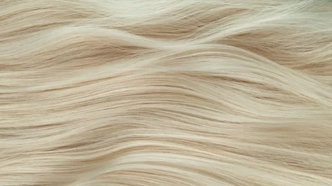 Super slow motion of wavy blonde hair in detail. Stock Footage 245504936