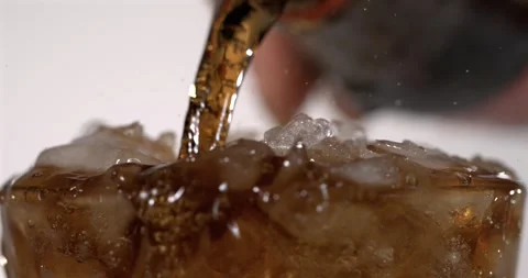 Super slow motion, White Bartender Pouring Soda Over Crushed Ice Stock Footage 330110747