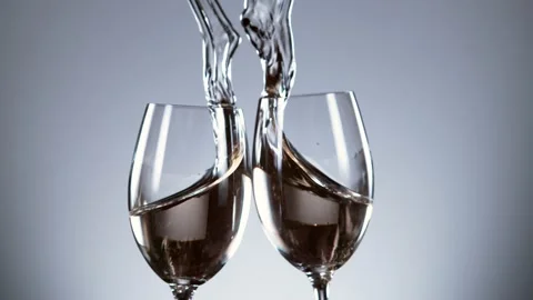 Super slow motion of white wine glasses in cheers gesture. Stock Footage 147277940