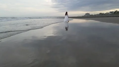 Super Slow Motion Wide Angle Woman at Beach Stock Footage 147306117