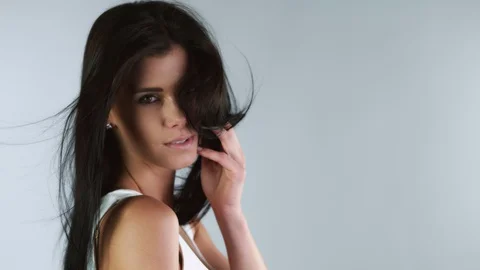 Super slow motion of young attractive brunette woman portrait Stock Footage 129573235