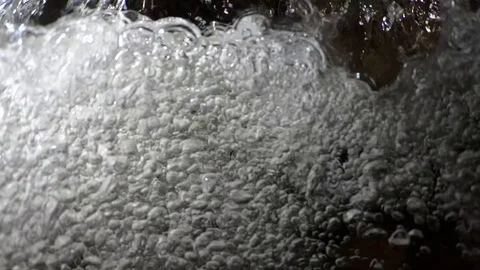 Super slow underwater bubbles rising to surface close up Video stock 99129406